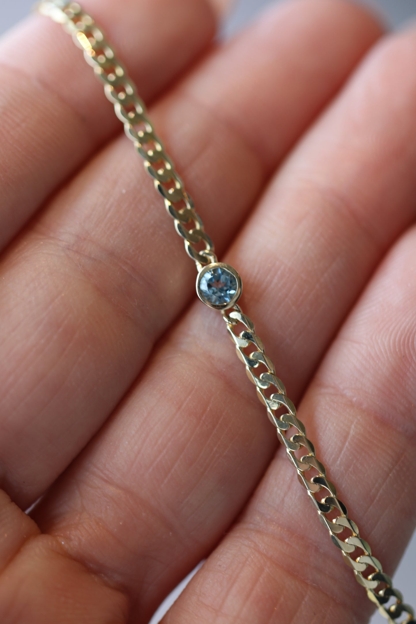 Birthstone Bracelet with a Round Genuine Aquamarine attached to a 3mm Curb Chain in Solid 14k Gold