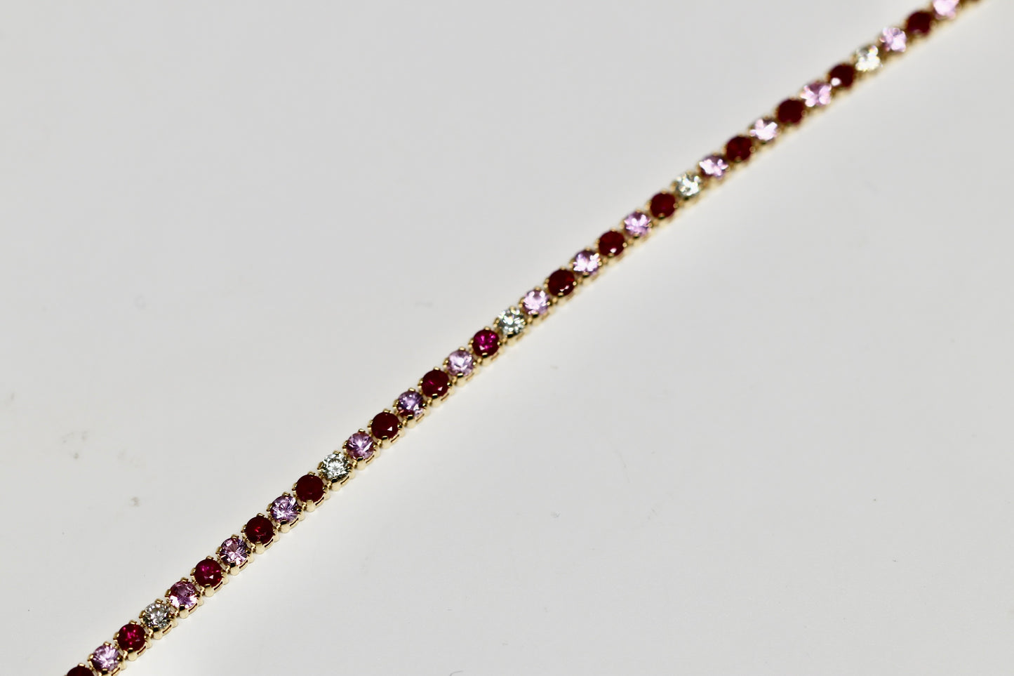 PINK Gemstone Tennis Bracelet with Rubies, Pink Sapphires, And Diamonds in 14K Yellow Gold