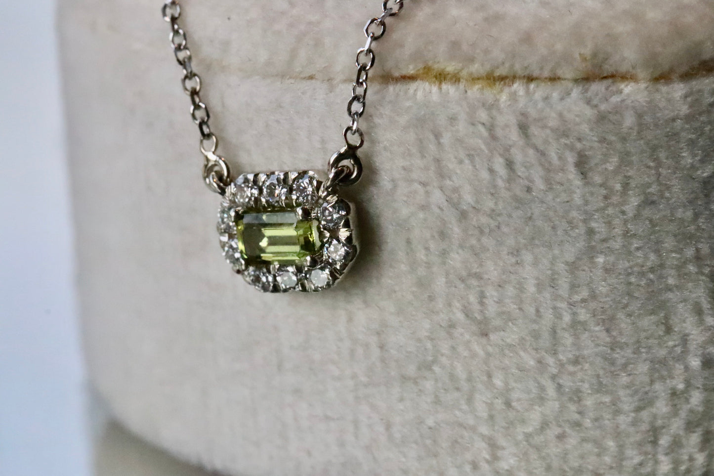 Emerald Cut Peridot Surrounded by a Diamond Halo