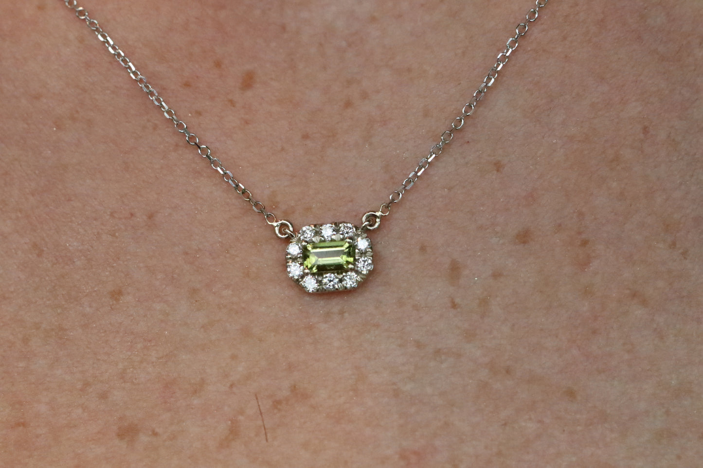 Emerald Cut Peridot Surrounded by a Diamond Halo