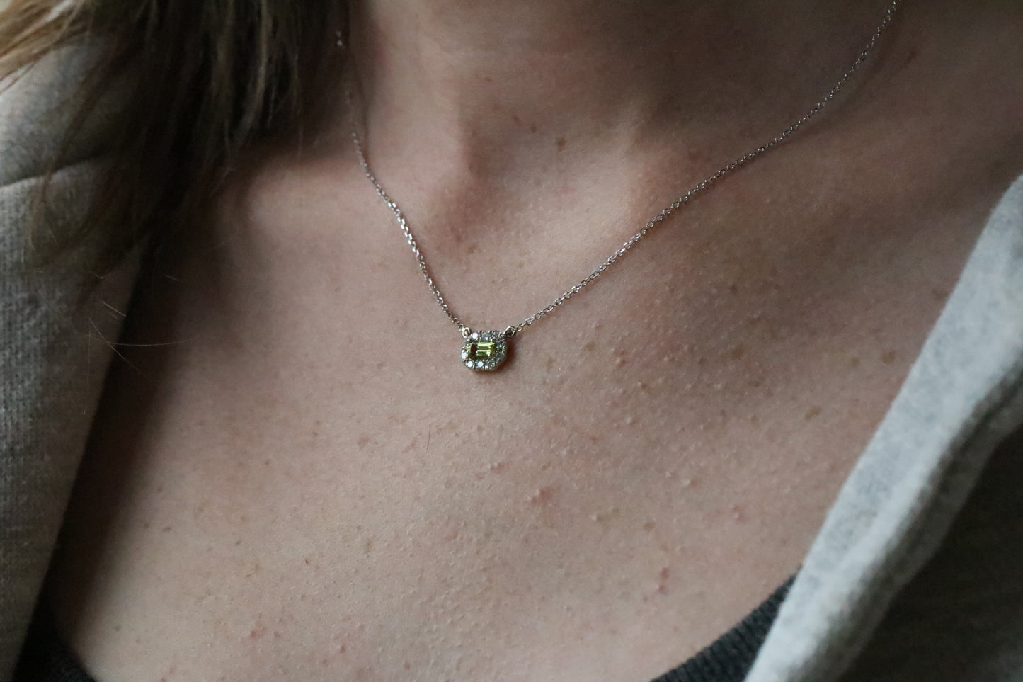 Emerald Cut Peridot Surrounded by a Diamond Halo