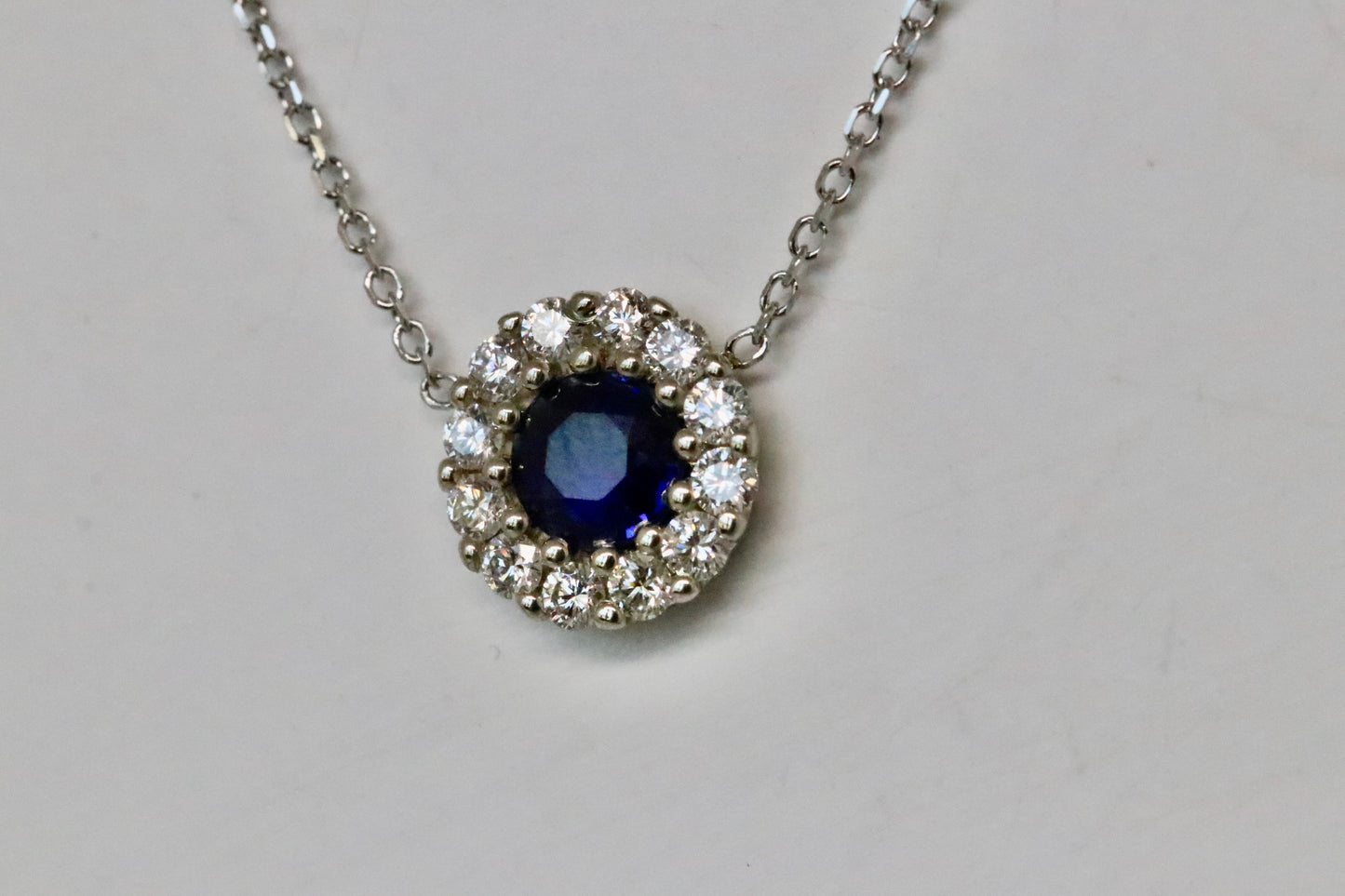 Round Blue Sapphire Diamond Halo Pendant in 14kt White Gold