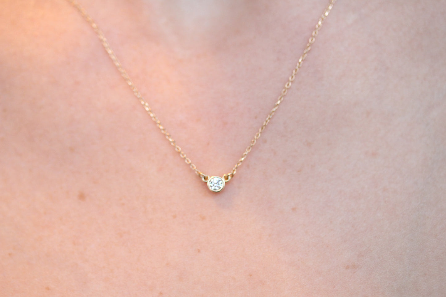 Timeless Bezel Set Round Diamond Pendant In 14kt Gold