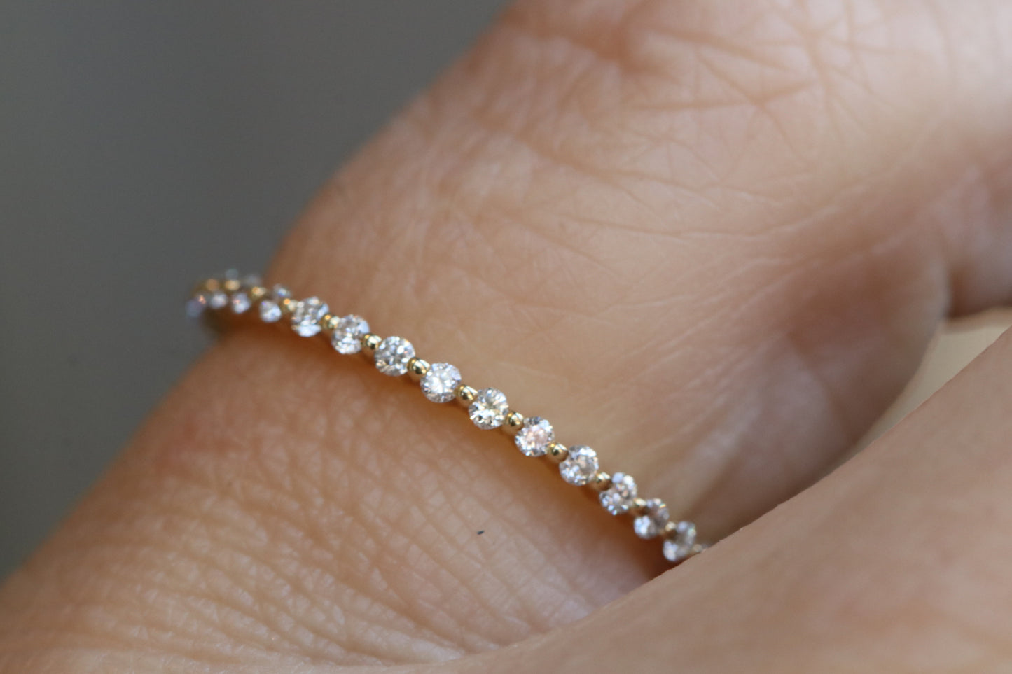 14kt Yellow Gold and Diamonds Eternity Single Prong Band in Size 7