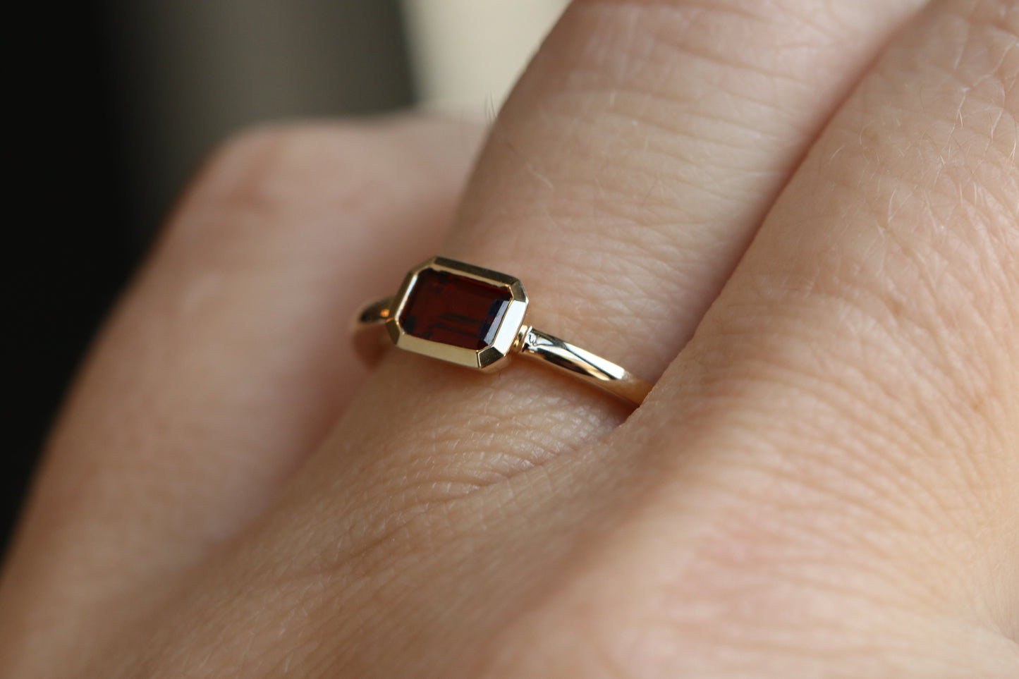 Bezel set Emerald Cut Garnet Ring in 14k Gold
