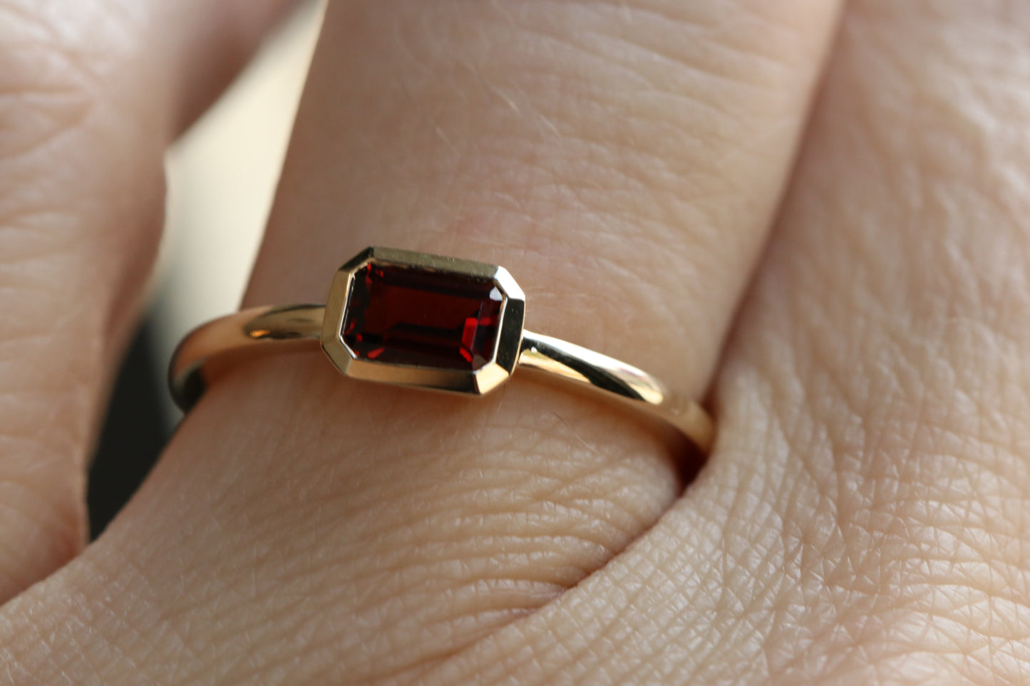 Bezel set Emerald Cut Garnet Ring in 14k Gold