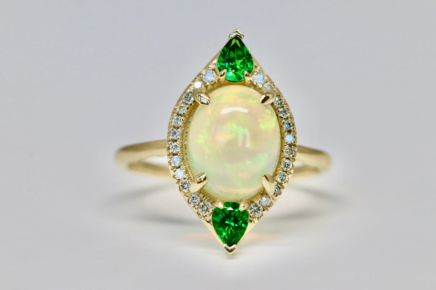 Oval Opal Cut, Green Garnet, and Diamond Halo Ring in Solid 14kt Gold