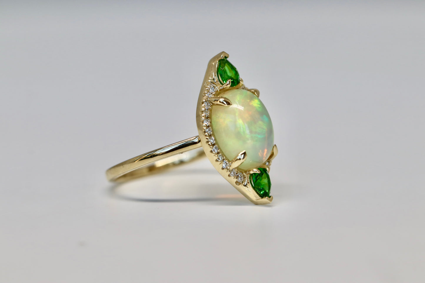 Oval Opal Cut, Green Garnet, and Diamond Halo Ring in Solid 14kt Gold