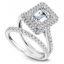white gold double halo engagement ring with emerald center
