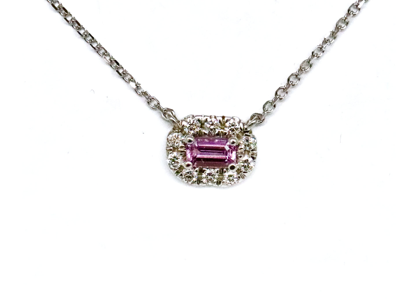 Emerald Cut Pink Tourmaline Surrounded by a Diamond Geometric Halo