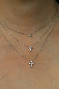 small, medium, and large diamond cross necklace
