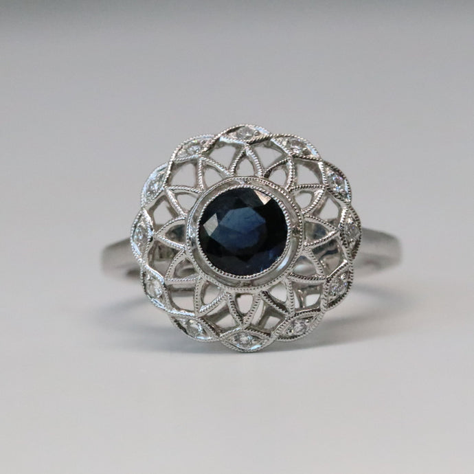 Art Deco styled blue sapphire diamond halo ring