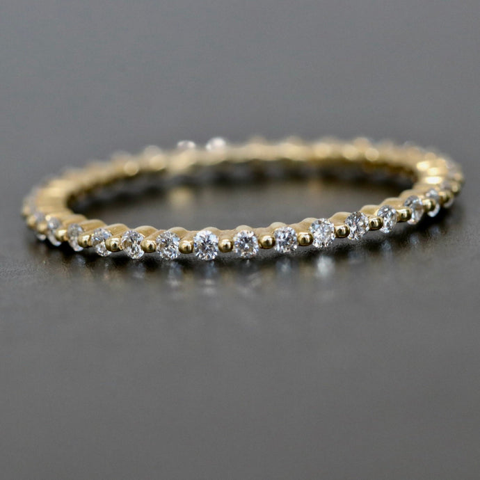 14kt Yellow Gold and Diamonds Eternity Single Prong Band in Size 7