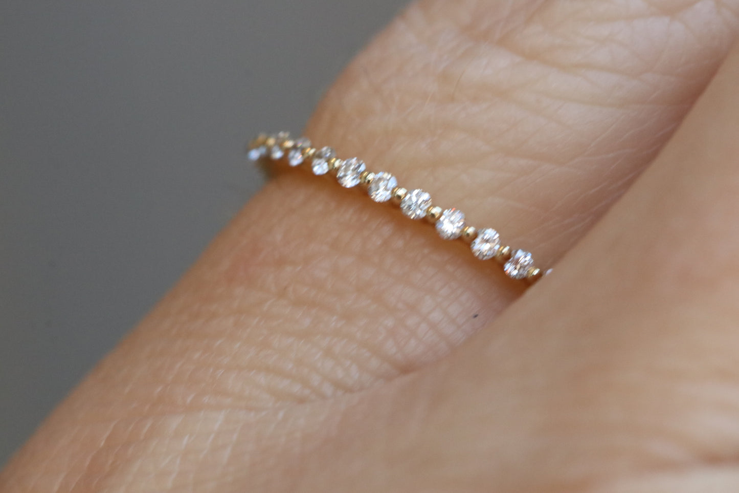 14kt Yellow Gold and Diamonds Eternity Single Prong Band in Size 7