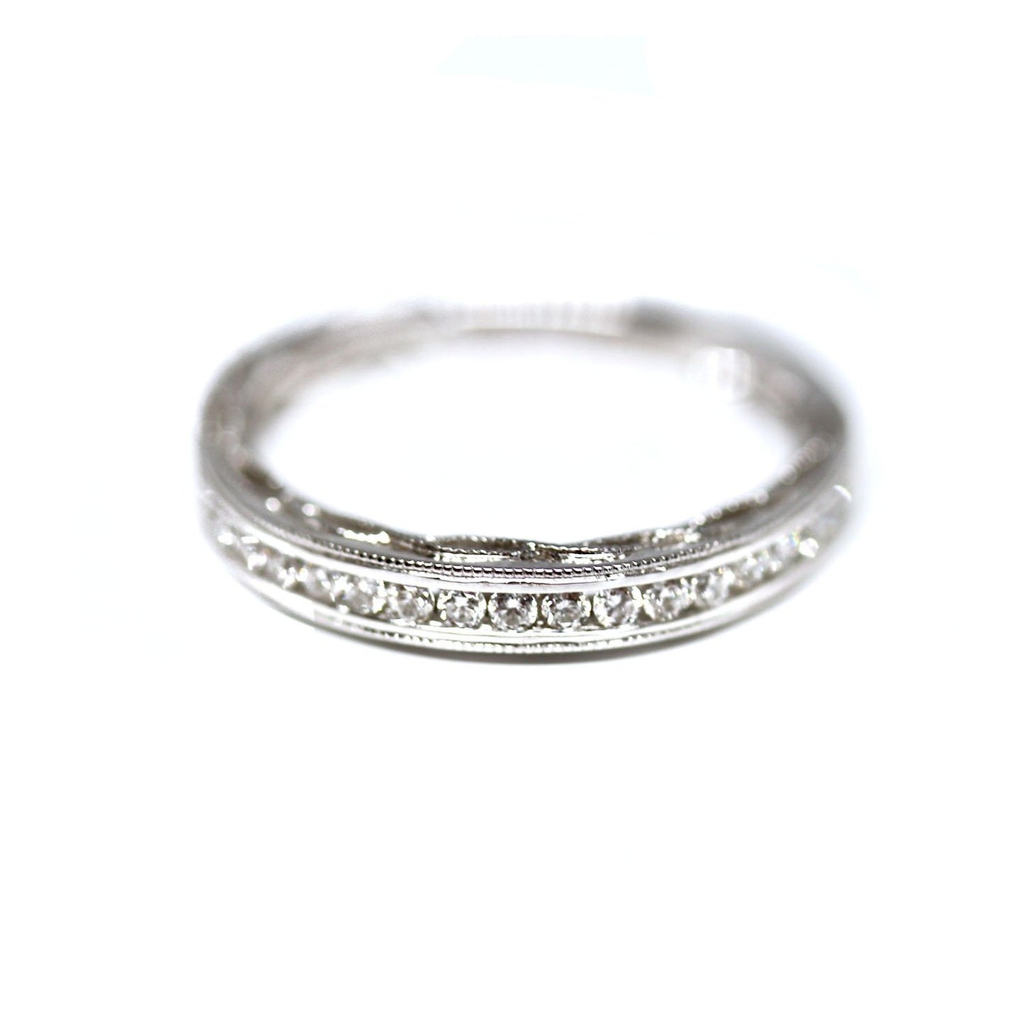 Decorative Channel Set Round Diamond Wedding Band with Twist Design on Sides